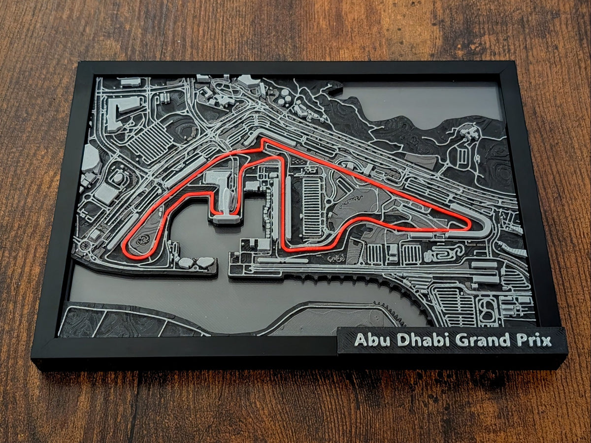 Magicland 3D Abu Dhabi Grand Prix pisti 3D kabartma tablo, kırmızı yarış çizgisi ve detaylı pist çevresi.
