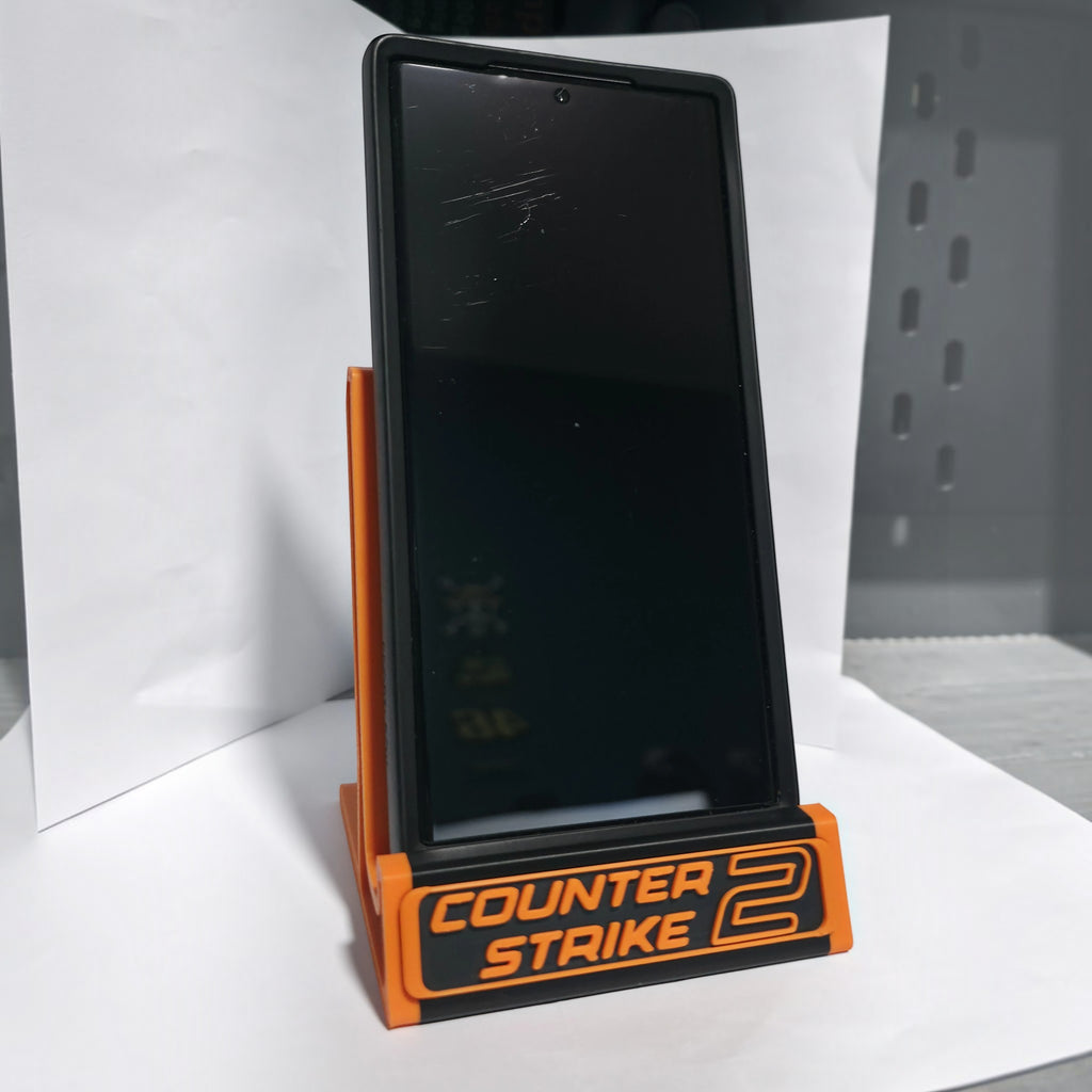 Magicland 3D turuncu siyah Counter Strike 2 temalı 3D baskı telefon standı