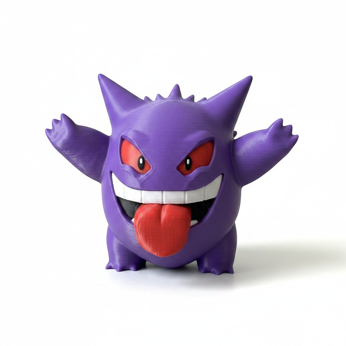 Magicland 3D Gengar figürü, mor renkli, kırmızı gözlü ve dilini çıkarmış, koleksiyonluk figür.