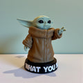 Magicland 3D Grogu figure in brown robe with black base saying "WHAT YOU SAID".