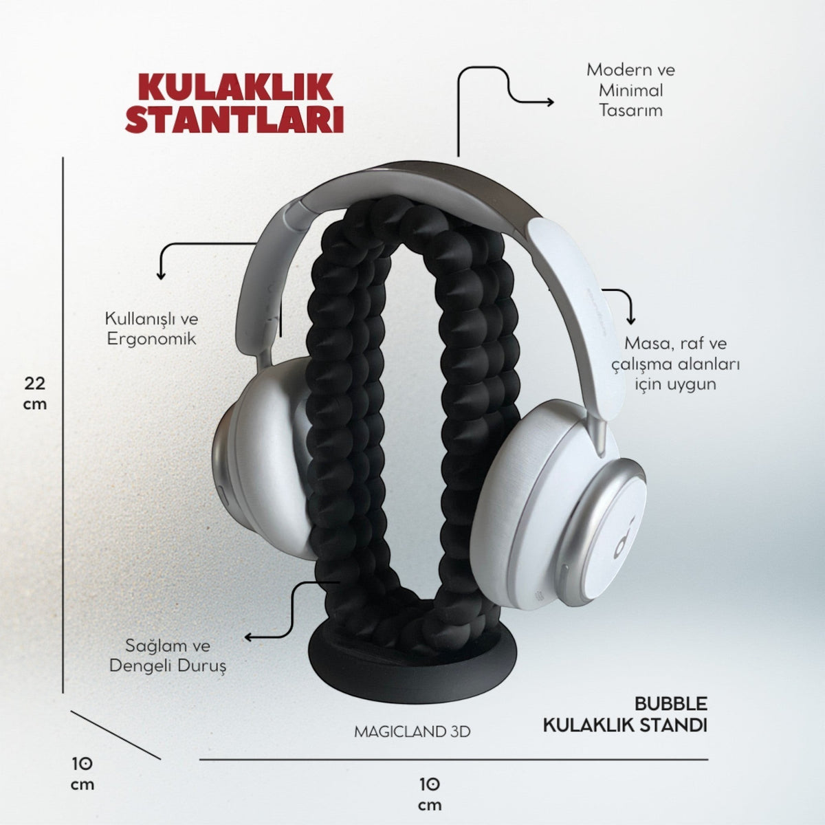 Magicland 3D bubble headphone stand in black, holding white headphones. Modern, ergonomic design for desks and shelves.