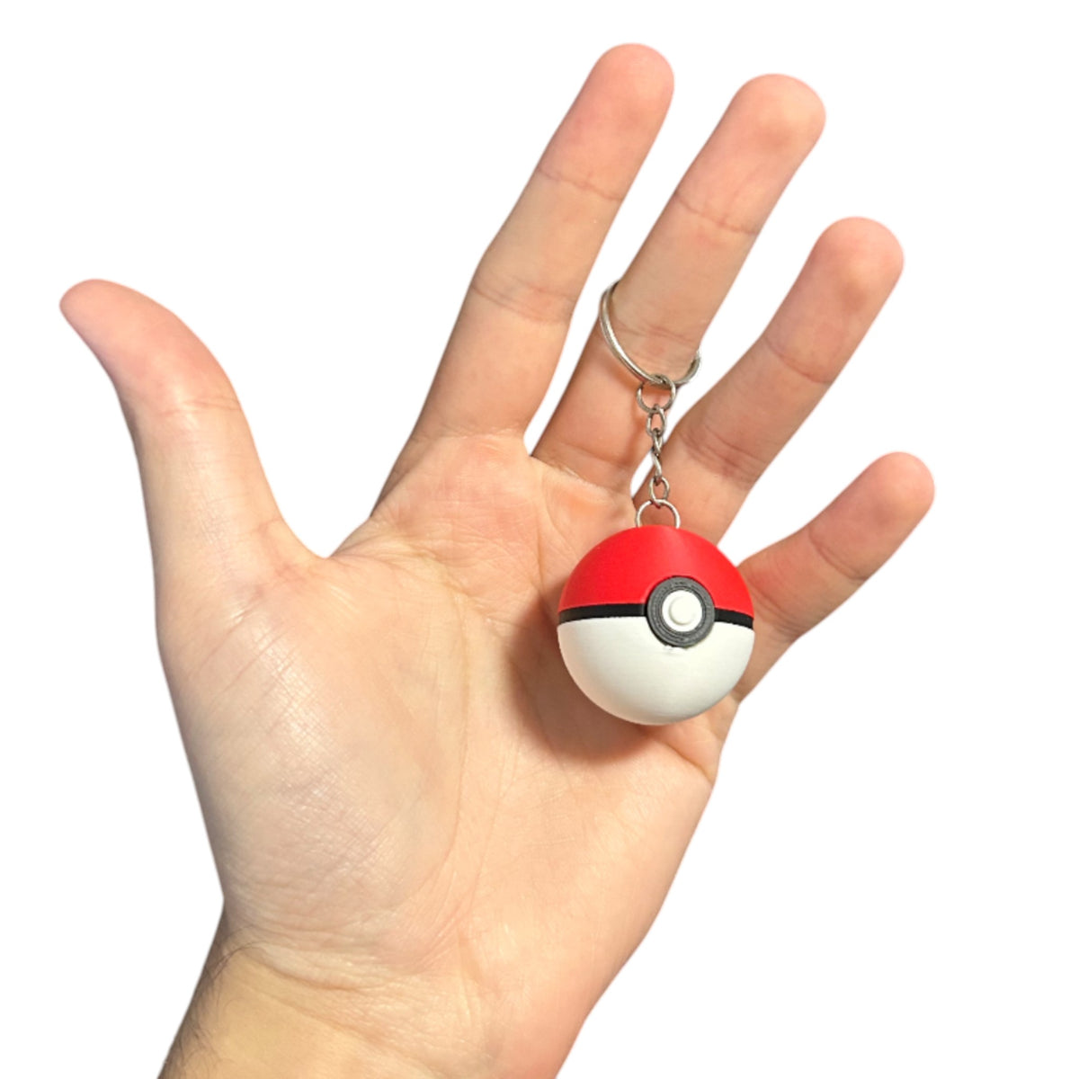 Magicland 3D kırmızı ve beyaz Pokeball anahtarlık, siyah detaylı, metal halkalı.