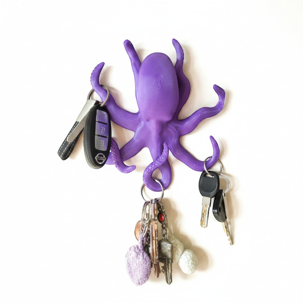 Magicland 3D purple octopus shaped key holder with 3 tentacles holding keys and a keychain.