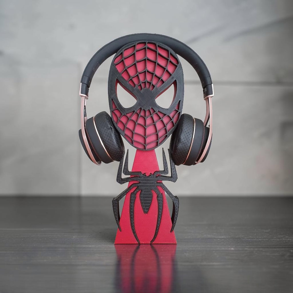 Magicland 3D Spiderman mask headphone stand in black and red, featuring a spider emblem.