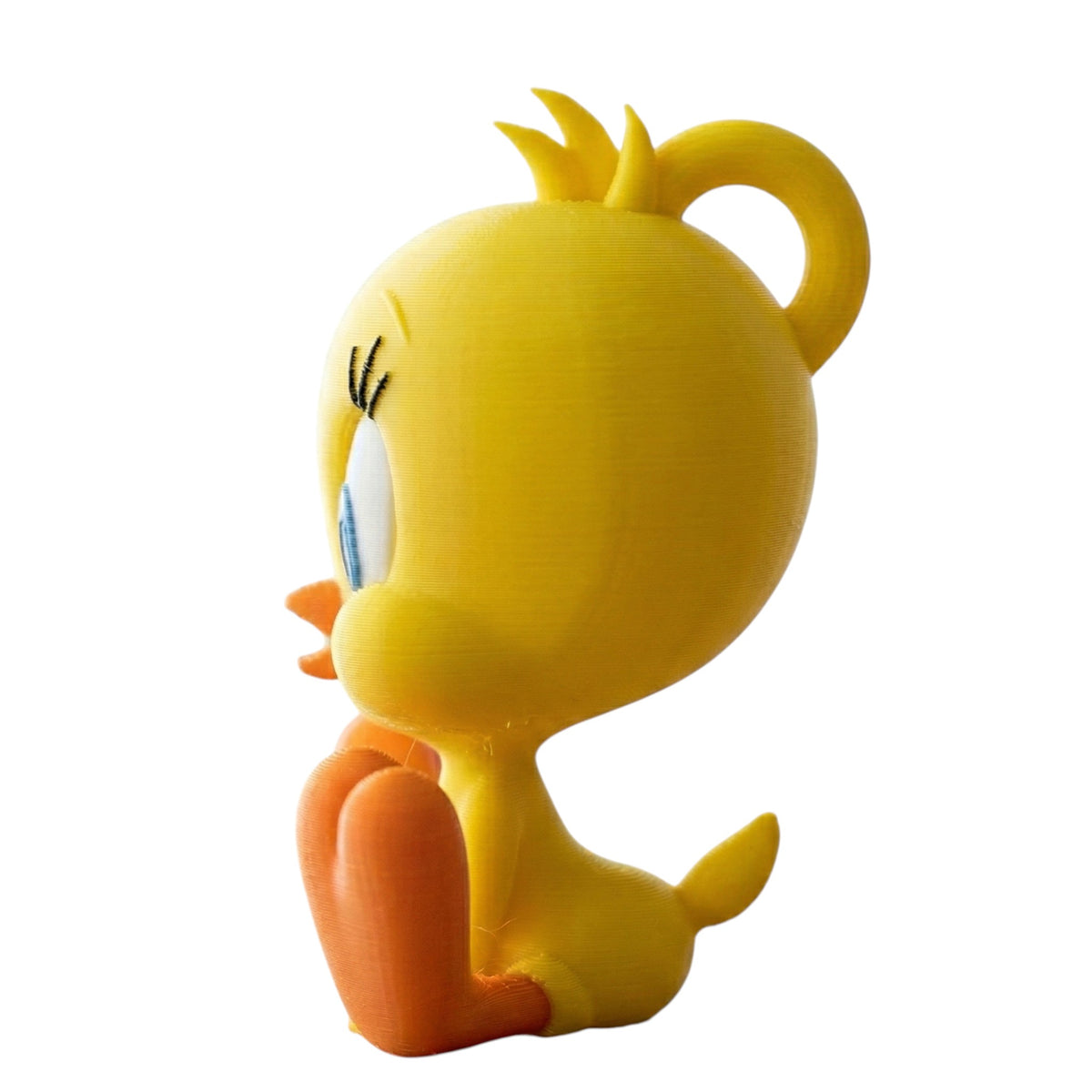 Magicland 3D sarı Tweety anahtarlık, oturur pozisyonda, mavi gözlü ve turuncu gagalı, sevimli bir aksesuar.
