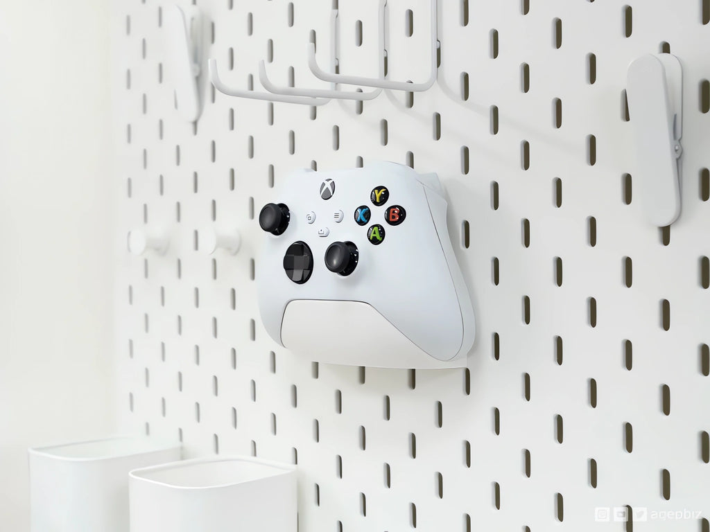 Magicland 3D white Xbox controller holder mounted on a white pegboard, ideal for organizing gaming accessories.
