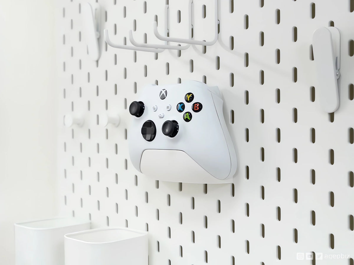 Magicland 3D white Xbox controller holder mounted on a white pegboard, ideal for organizing gaming accessories.