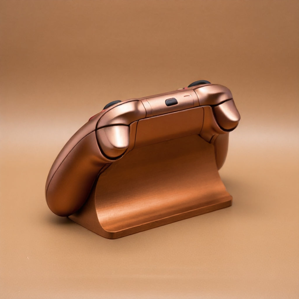 Magicland 3D, bronz renkli Xbox kontrolcü standı, sade ve fonksiyonel tasarım, gaming aksesuarı.