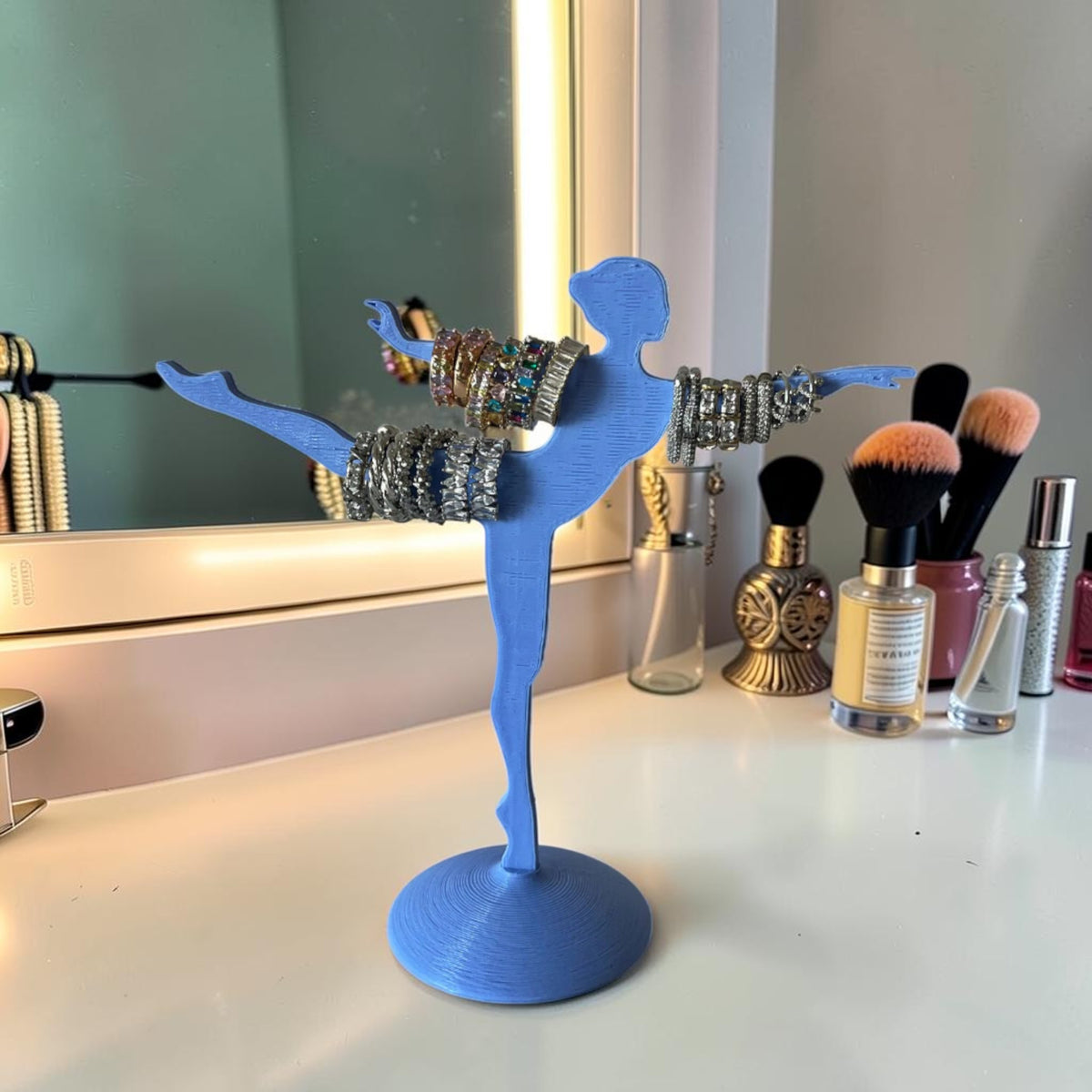Magicland 3D light blue ballerina jewelry stand holding bracelets and rings. Decorative stand for rings and bracelets.