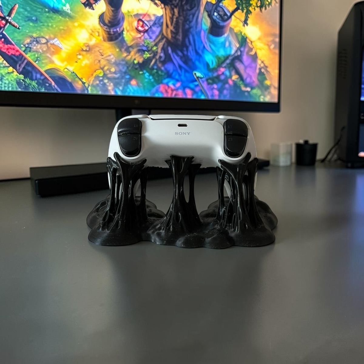 Magicland 3D black slime-effect controller stand holding a white PlayStation 5 controller.