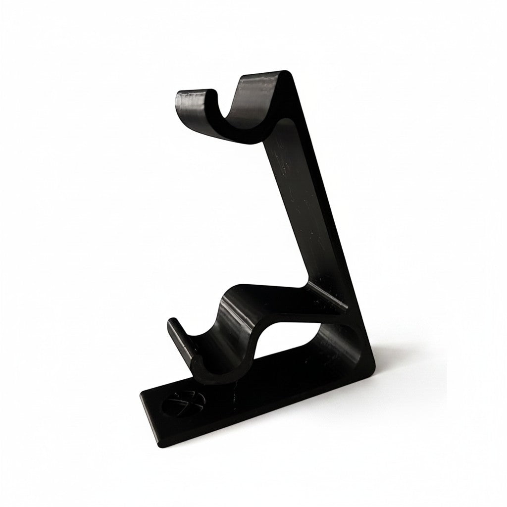 Black plastic dual vertical controller stand for Xbox controllers by Magicland 3D.
