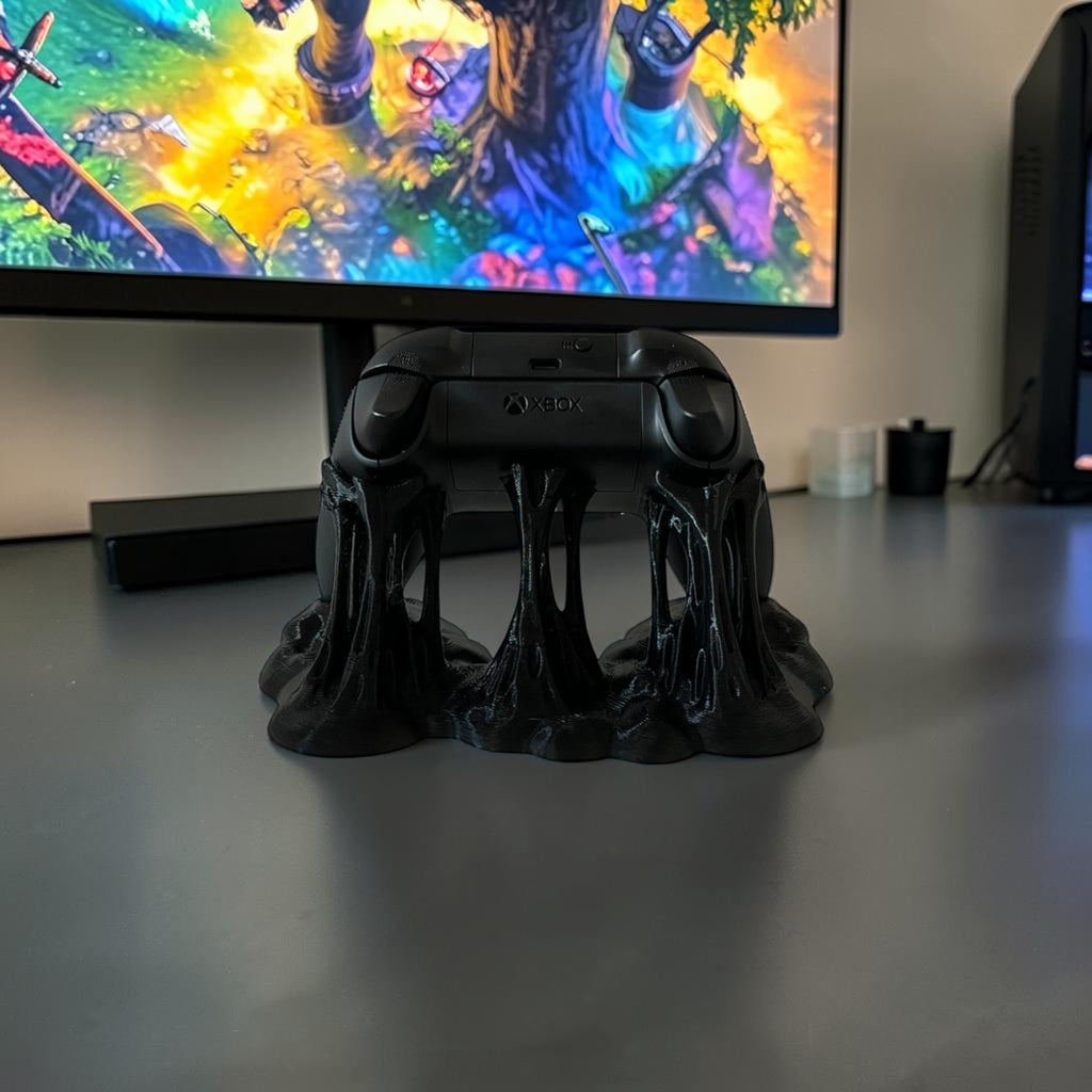 Black Xbox controller stand with a dripping, sticky effect. Holds one controller.