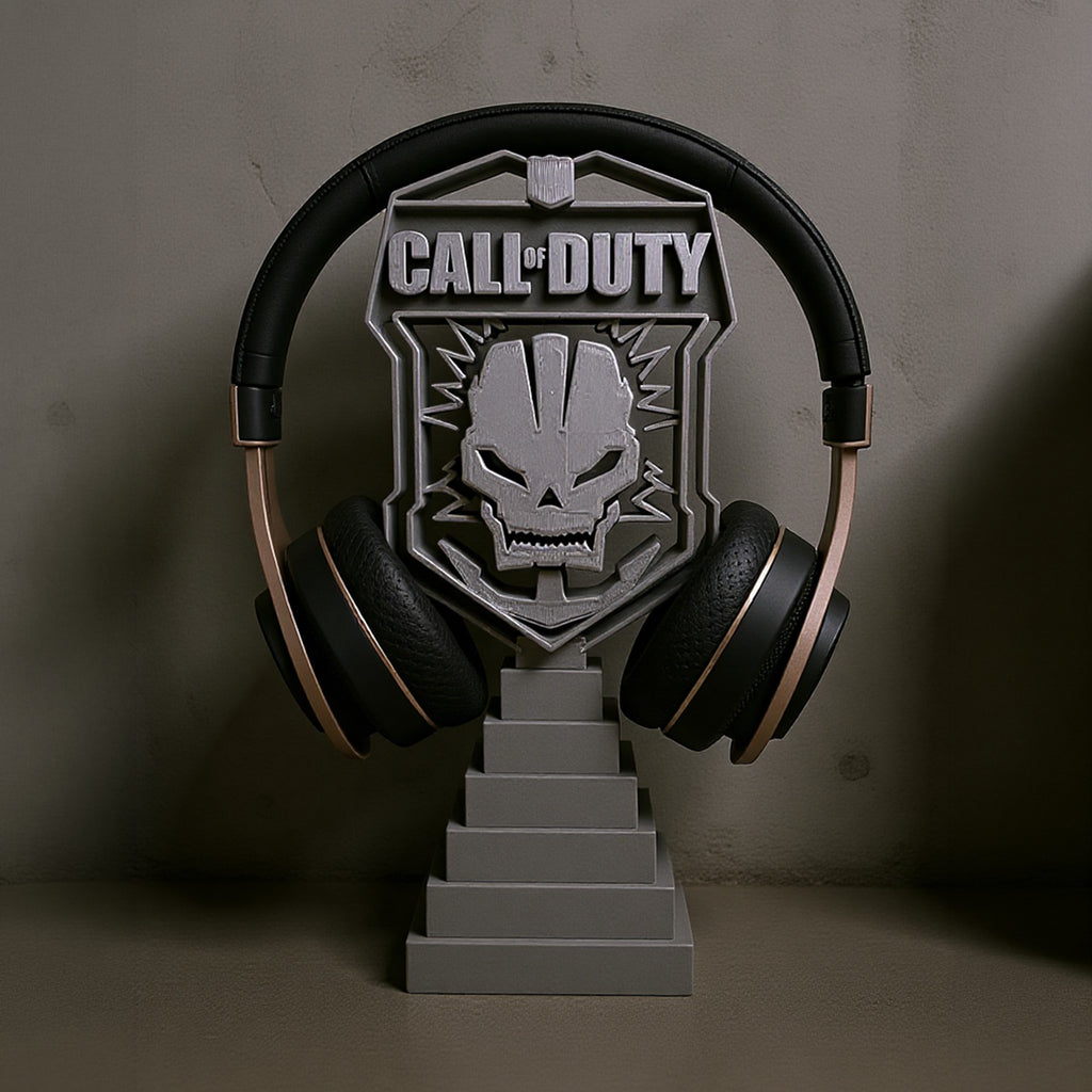 Magicland 3D Call of Duty themed headset stand with skull emblem and tiered base. Black and gold headphones shown.