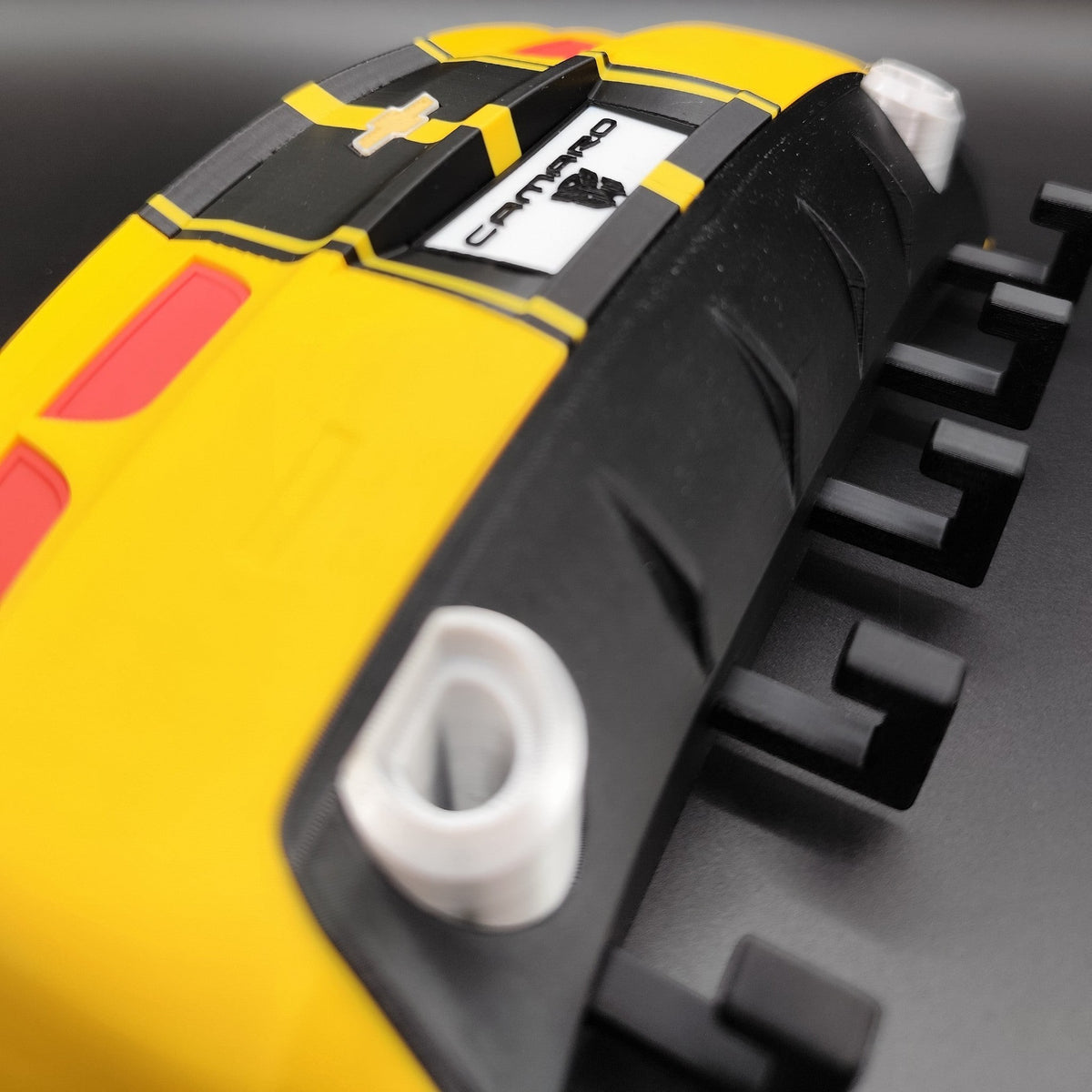 Magicland 3D Chevrolet Camaro yellow and black decorative keychain holder with red accents.
