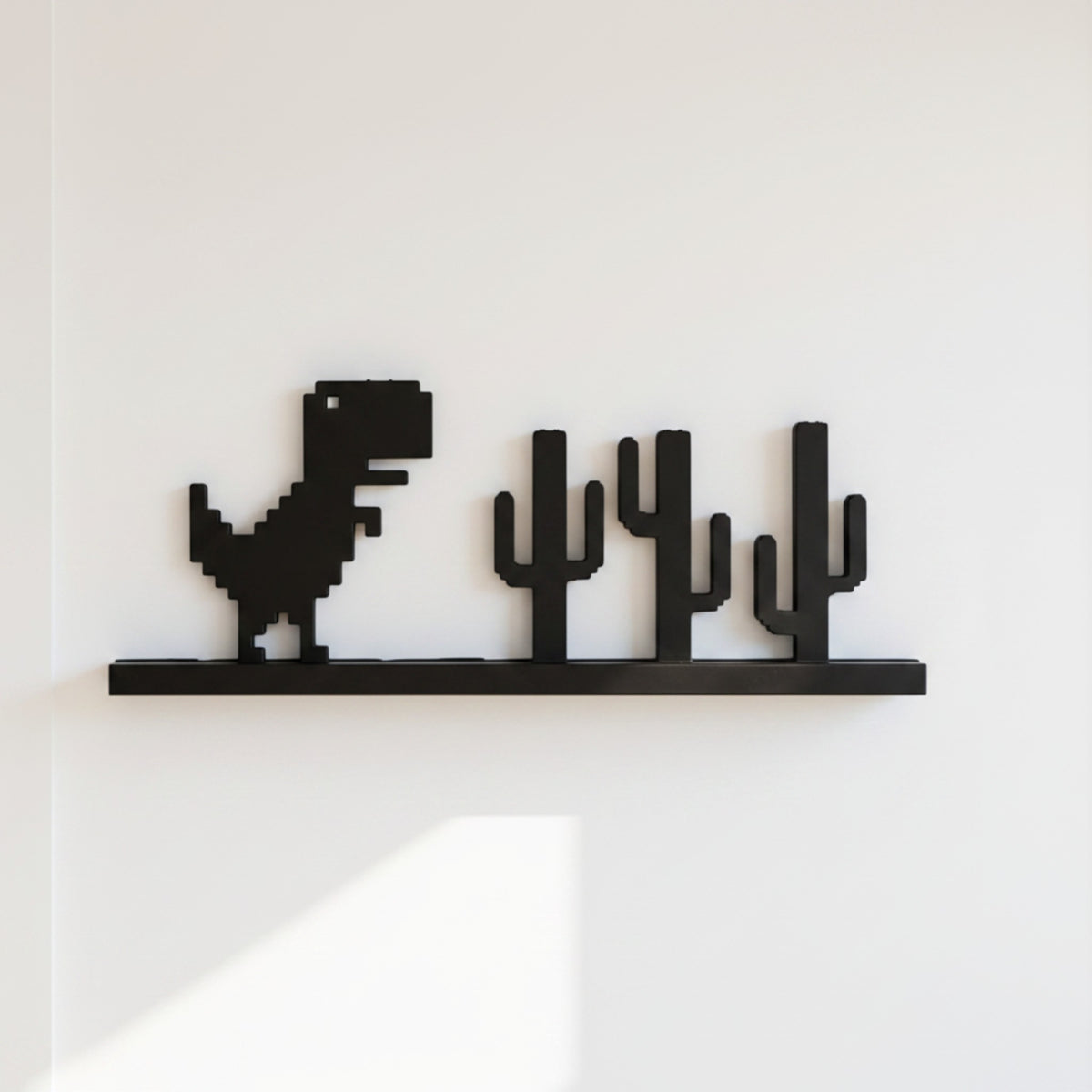 Magicland 3D black pixelated dinosaur and cactus decorative wall art.