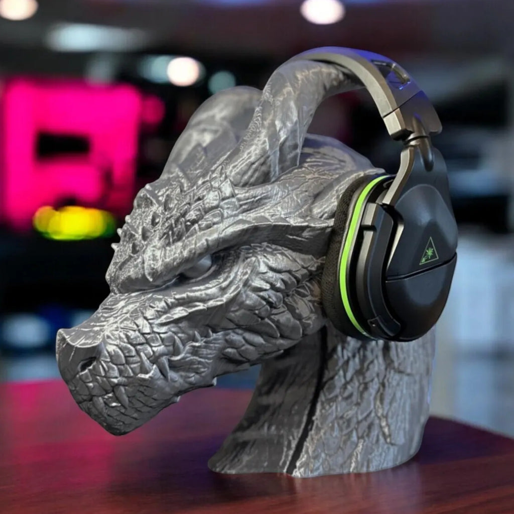 Magicland 3D grey dragon head headphone stand with black and green gaming headset