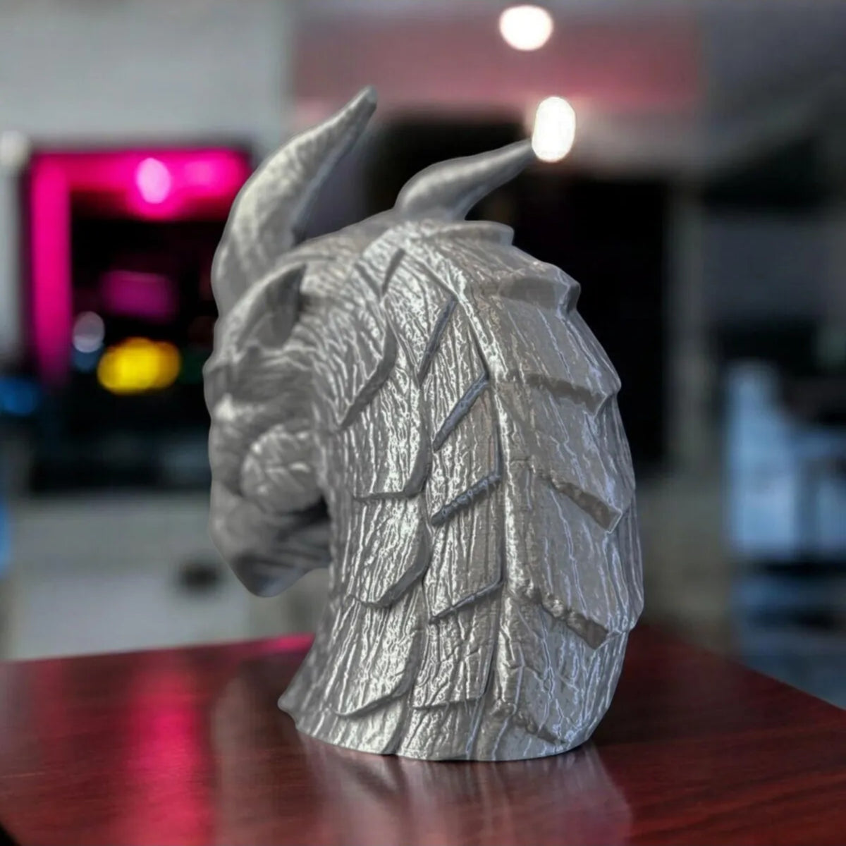 Magicland 3D silver dragon head headphone stand with textured scales and horns, a unique desk accessory.