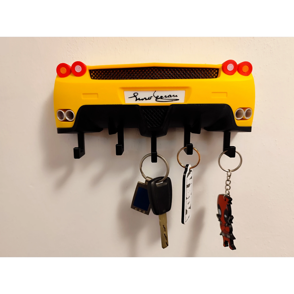 Magicland 3D yellow Ferrari Enzo rear end key holder with black accents and exhaust pipes. Holds four sets of keys.