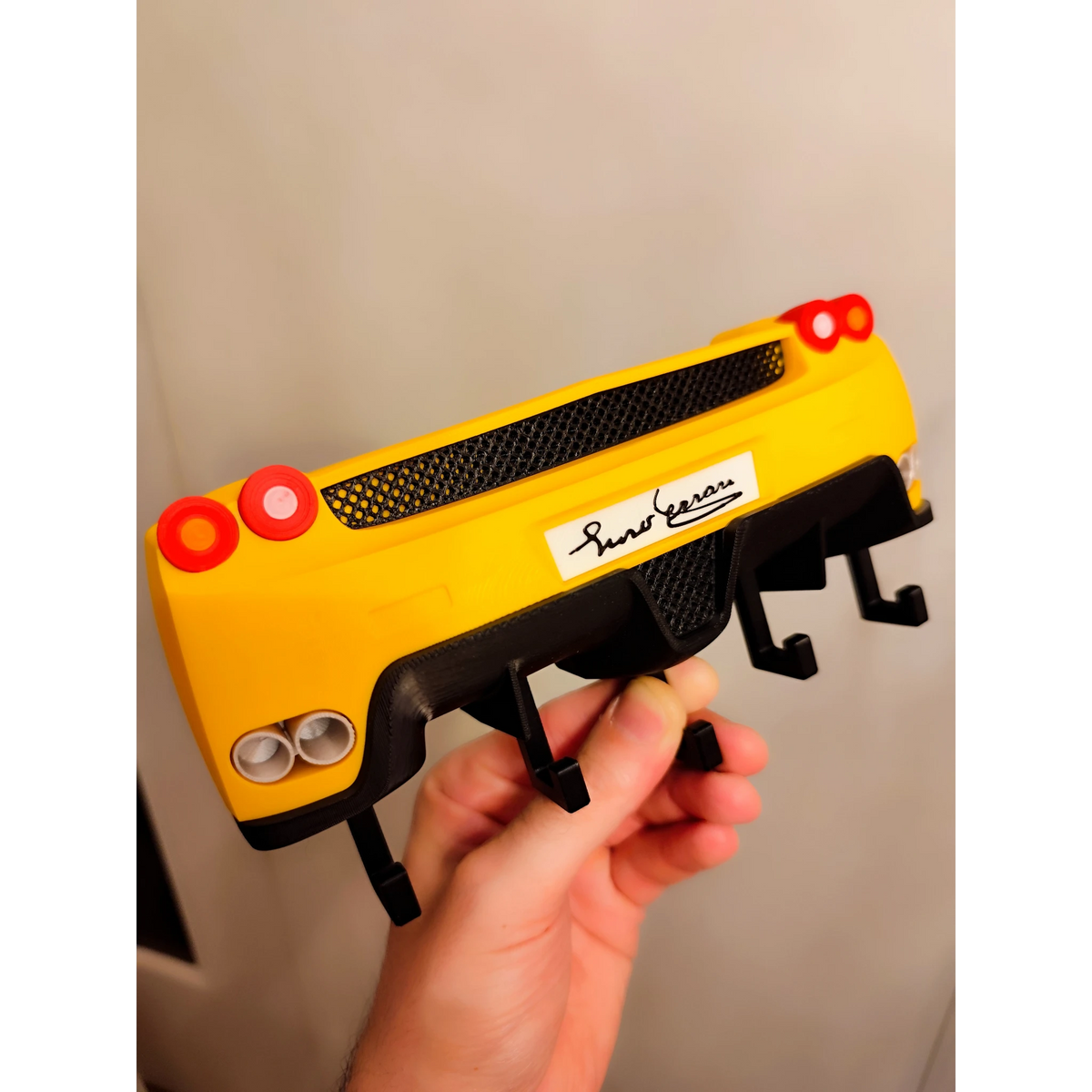 Magicland 3D yellow Ferrari Enzo rear end key holder with black accents and hooks.