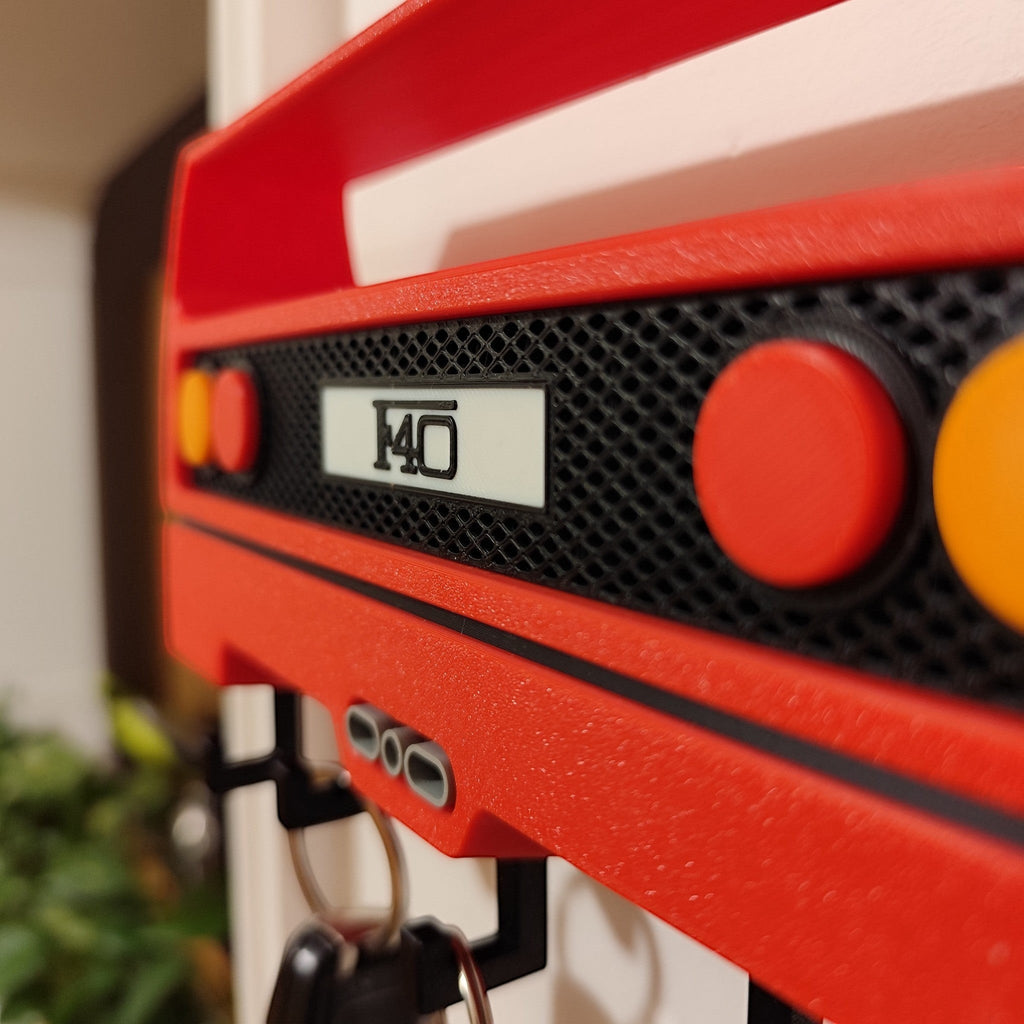 Magicland 3D red Ferrari F40 inspired key holder with black hooks and F40 emblem.