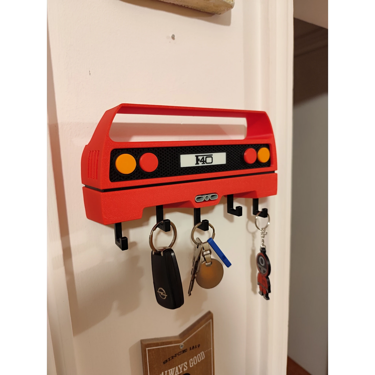 Magicland 3D red Ferrari F40 rear light design key holder with 4 hooks. Features F40 logo.