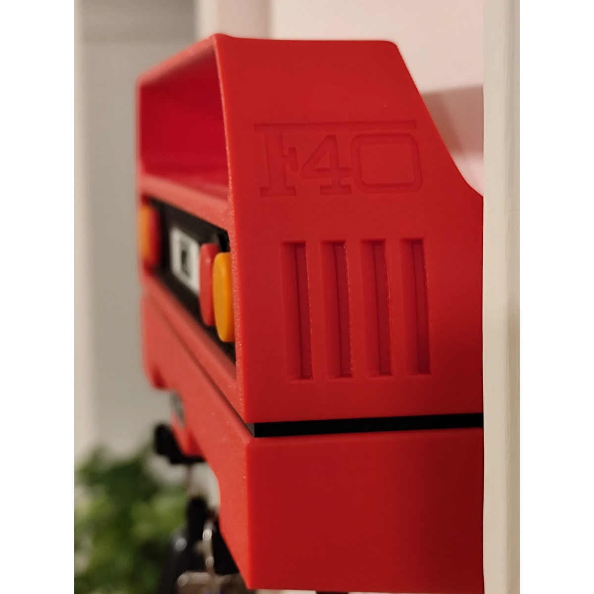 Magicland 3D red Ferrari F40 rear spoiler keychain holder with embossed F40 logo and vents.