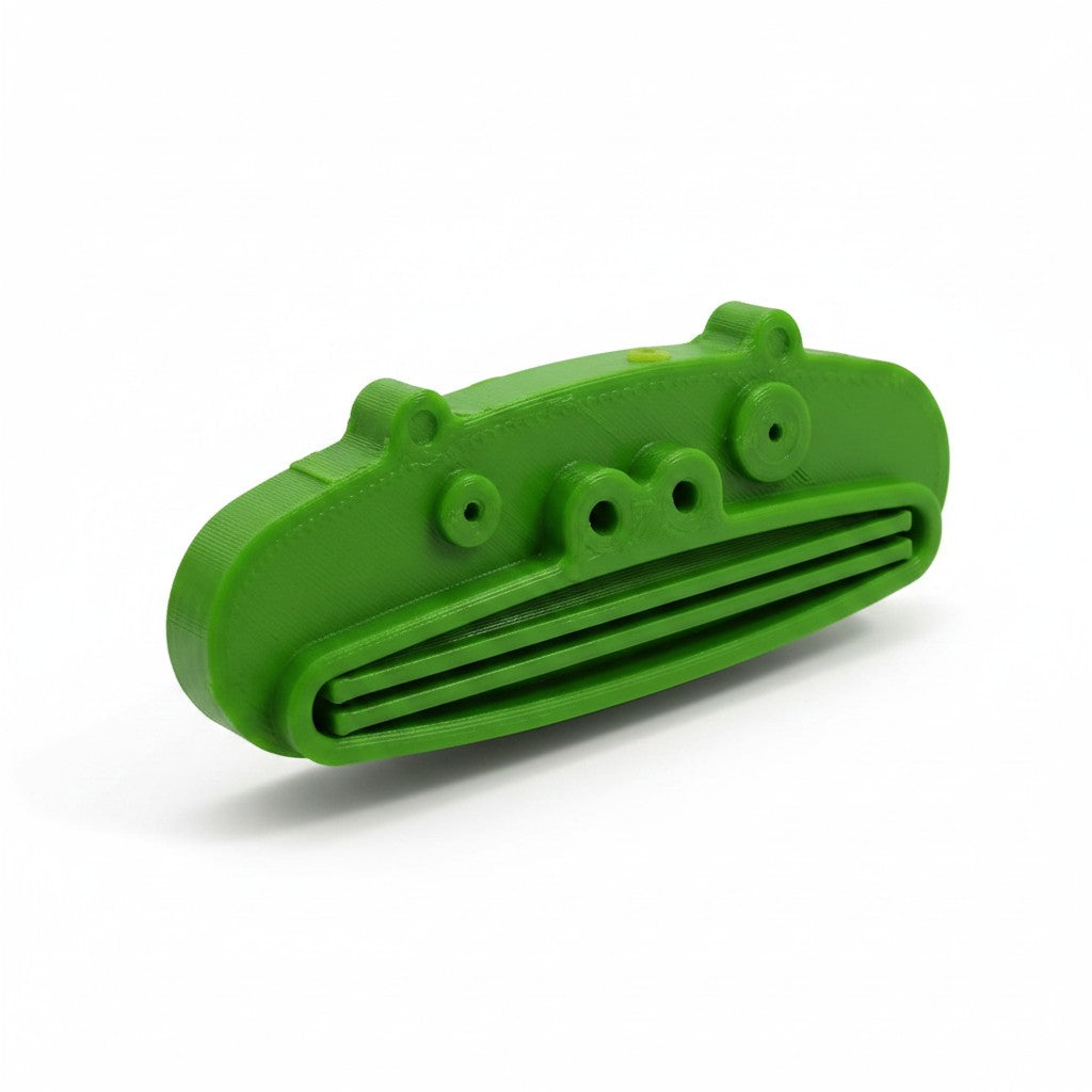 Magicland 3D green frog-shaped toothpaste squeezer, fun bathroom accessory for kids.