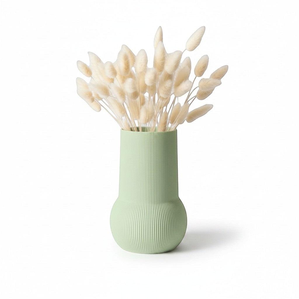 Magicland 3D decorative vase in pastel green with ribbed texture, holding dried bunny tail grass.