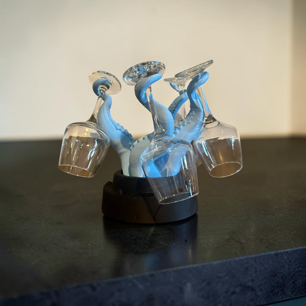 Magicland 3D blue octopus tentacle wine glass holder, holds four glasses.