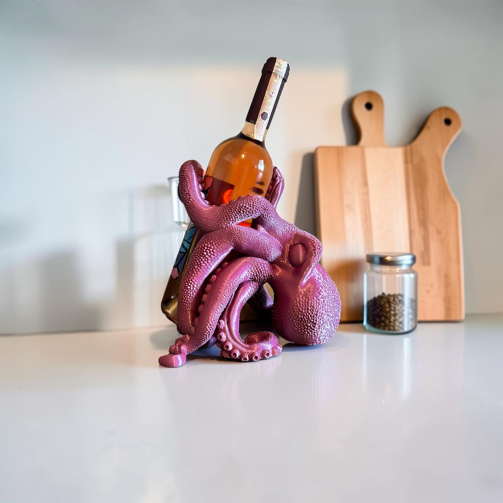 Magicland 3D purple octopus wine bottle holder, a unique and quirky accessory for your bar or kitchen counter.
