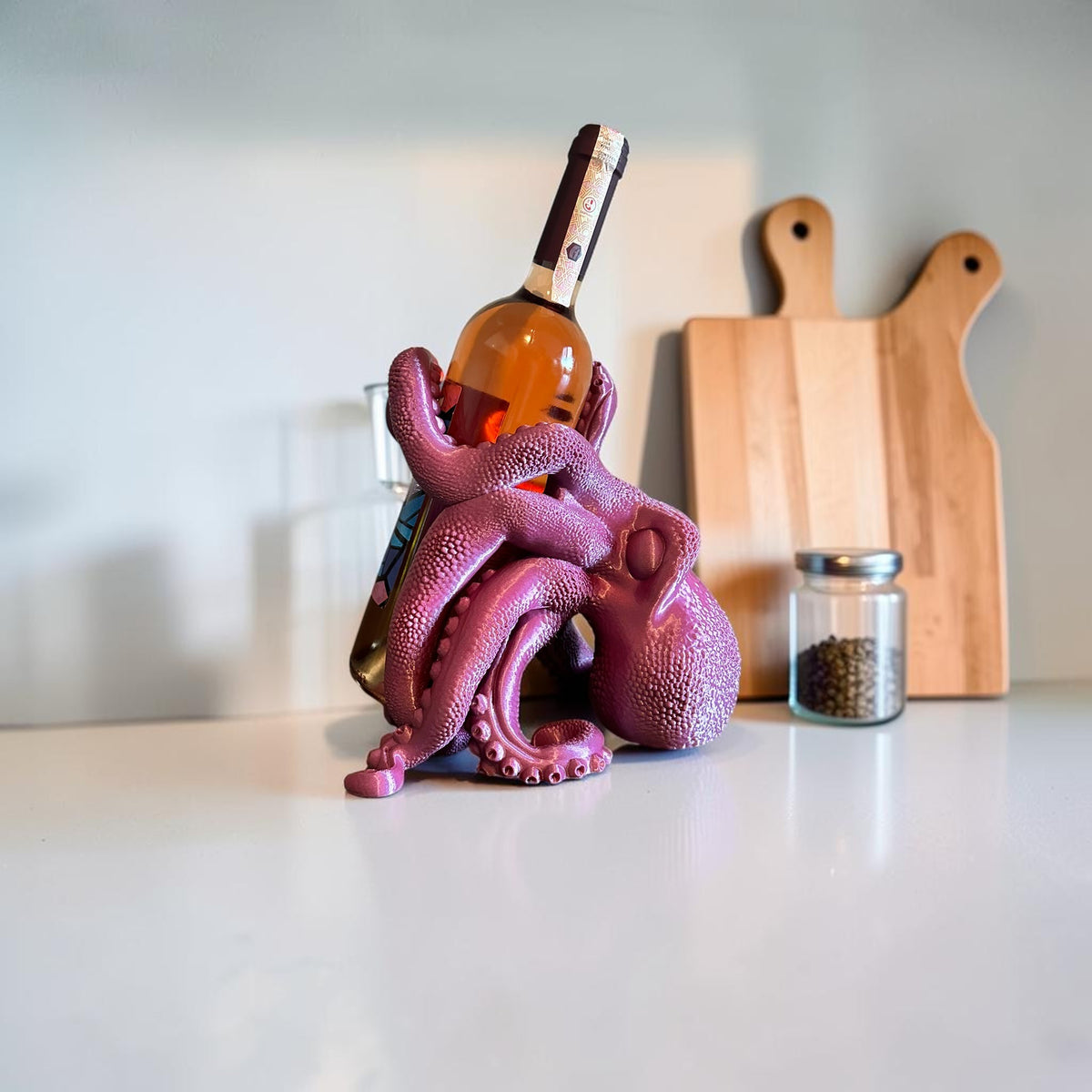 Magicland 3D purple octopus wine bottle holder, a unique and quirky accessory for your bar or kitchen counter.