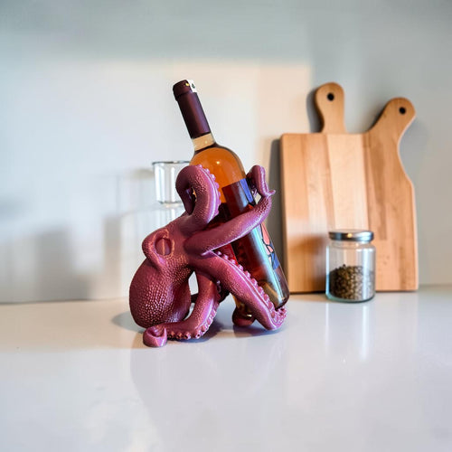 Magicland 3D purple octopus wine bottle holder, a unique and quirky accessory for your kitchen counter or bar.