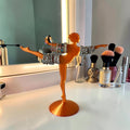 Magicland 3D orange ballerina jewelry stand holding bracelets and rings. Decorative and functional.