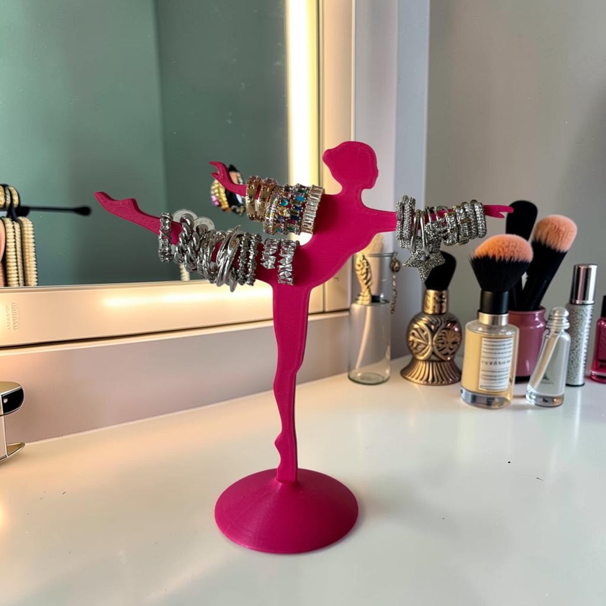 Magicland 3D pink ballet dancer jewelry stand holding bracelets and rings.
