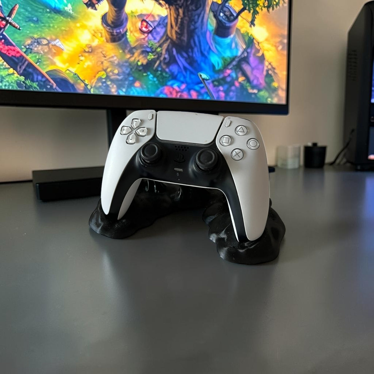 Magicland 3D black sticky effect controller stand holding a white PS5 controller.