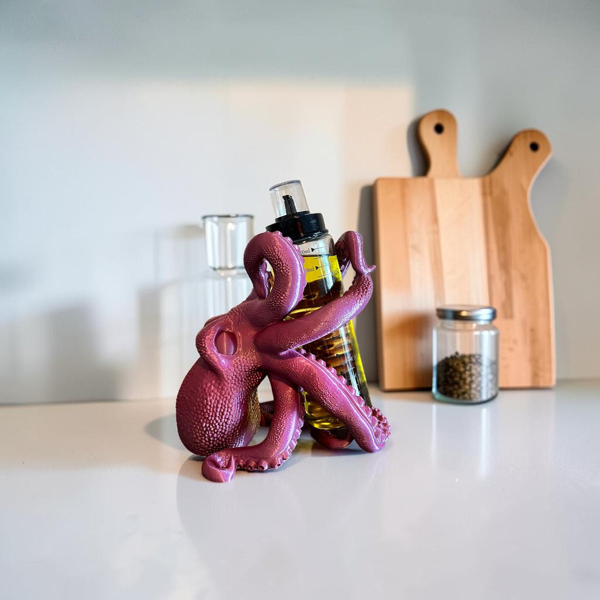 Magicland 3D purple octopus wine bottle holder with tentacles wrapped around a bottle.