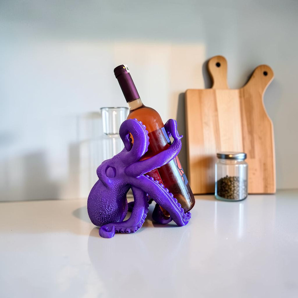 Magicland 3D purple octopus wine bottle holder, a unique and quirky accessory for your home bar.