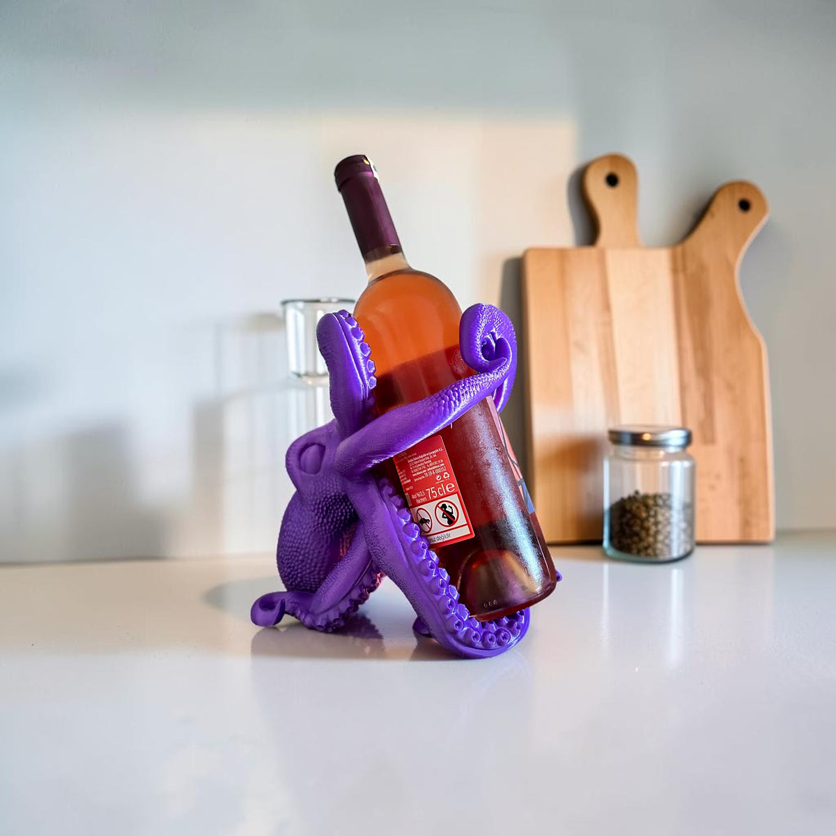 Magicland 3D purple octopus wine bottle holder, a fun and unique accessory for your home bar.