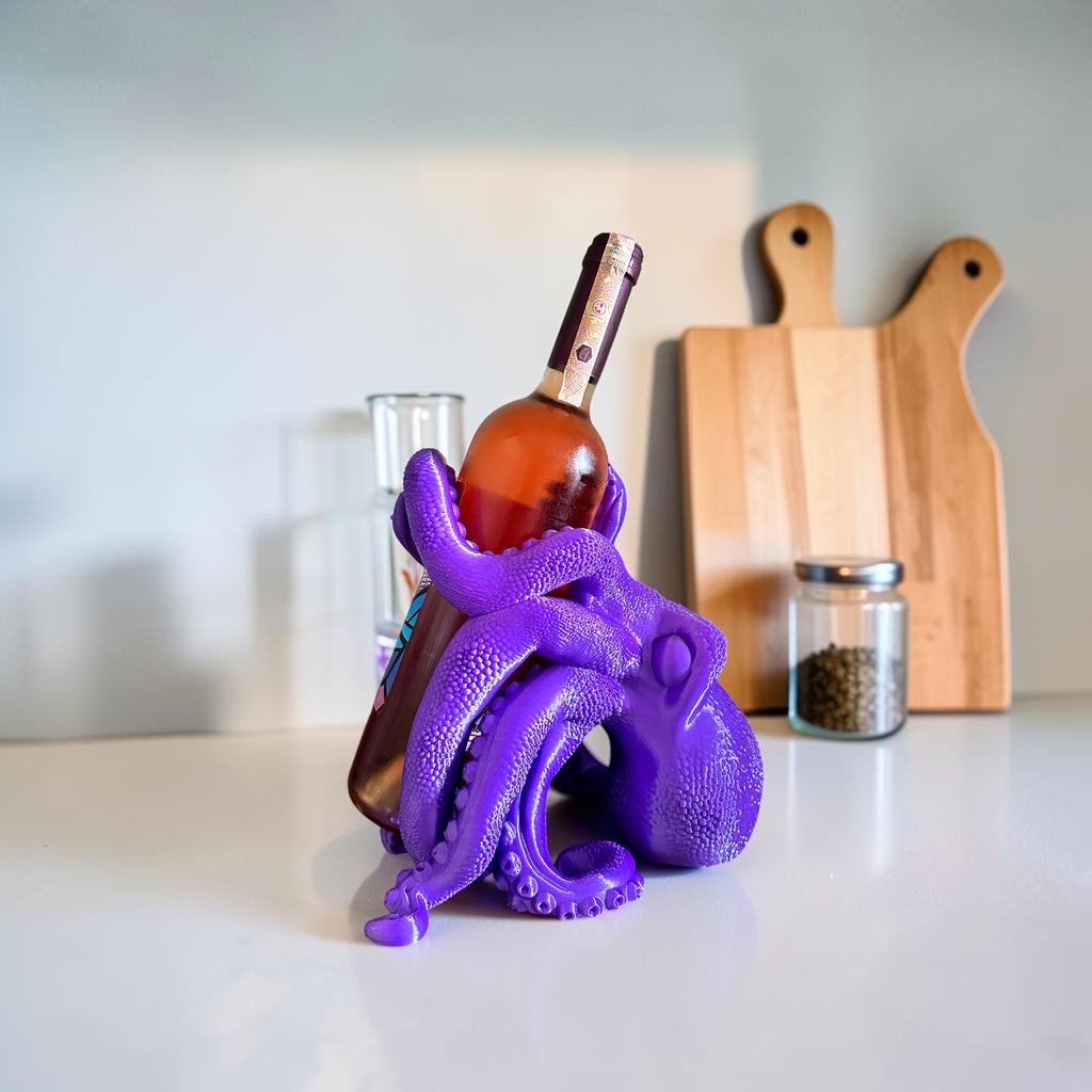 Magicland 3D purple octopus wine bottle holder, a unique and quirky accessory for your bar or kitchen counter.