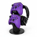 Magicland 3D purple Xbox controller and headset stand, holding two controllers vertically and a pair of black headphones.