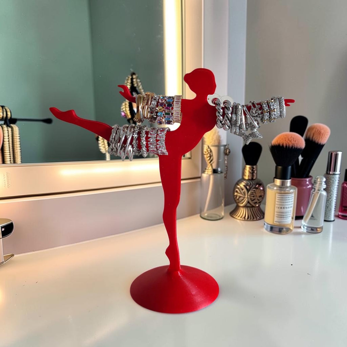 Magicland 3D red ballet dancer jewelry stand holding bracelets and rings. Decorative display for rings, bracelets, and earrings.