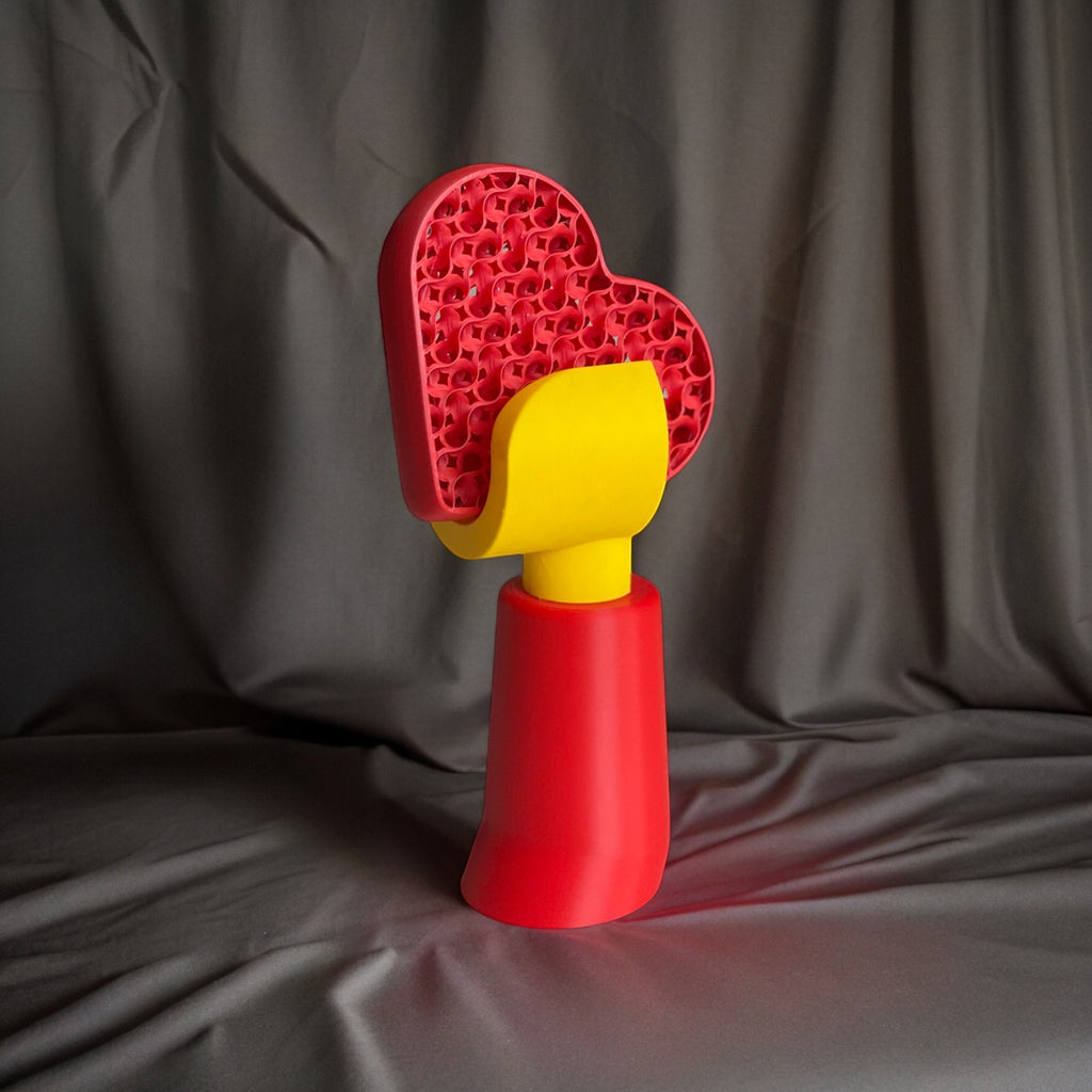 Magicland 3D red and yellow heart-shaped decorative hand holder with a textured surface.