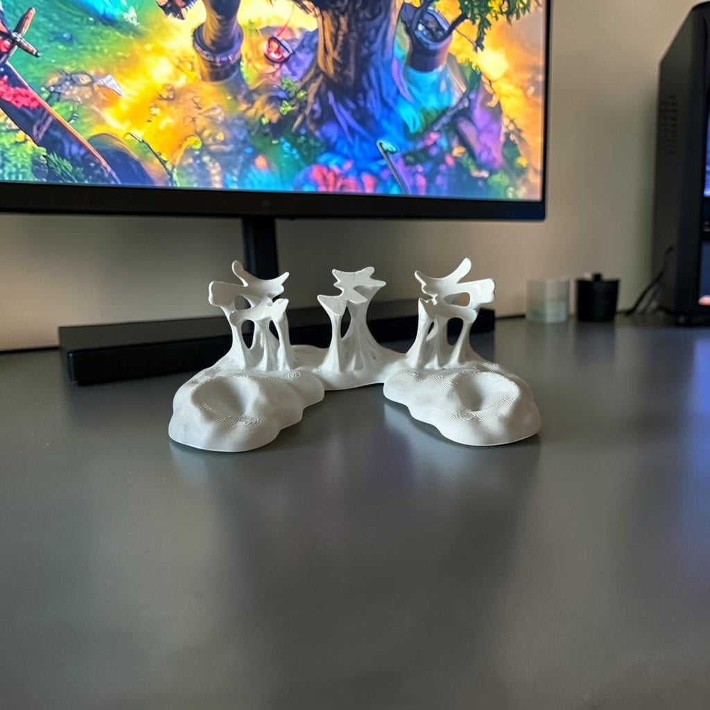 Magicland 3D white abstract decorative holder with organic, flowing shapes and textured base.