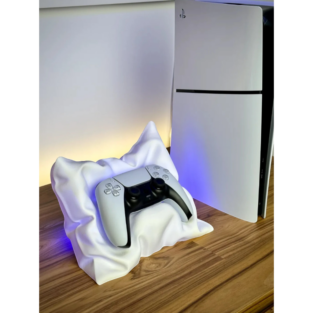 Magicland 3D white pillow-shaped stand holding a white PlayStation 5 controller next to the console.