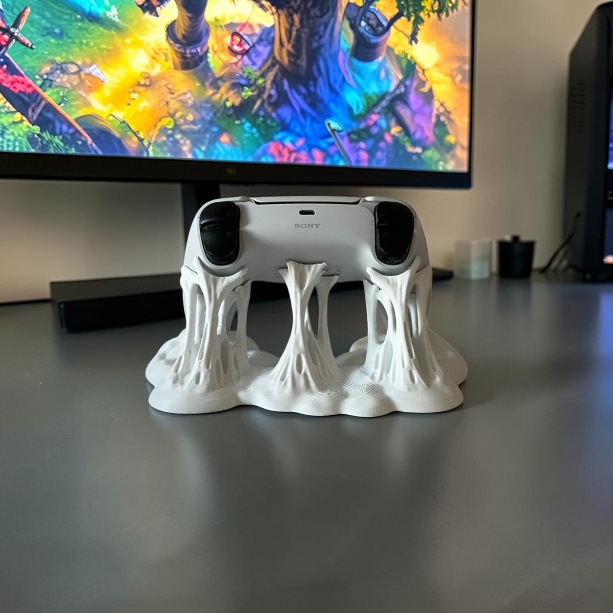 Magicland 3D white sticky effect controller stand holding a white Sony PlayStation controller.