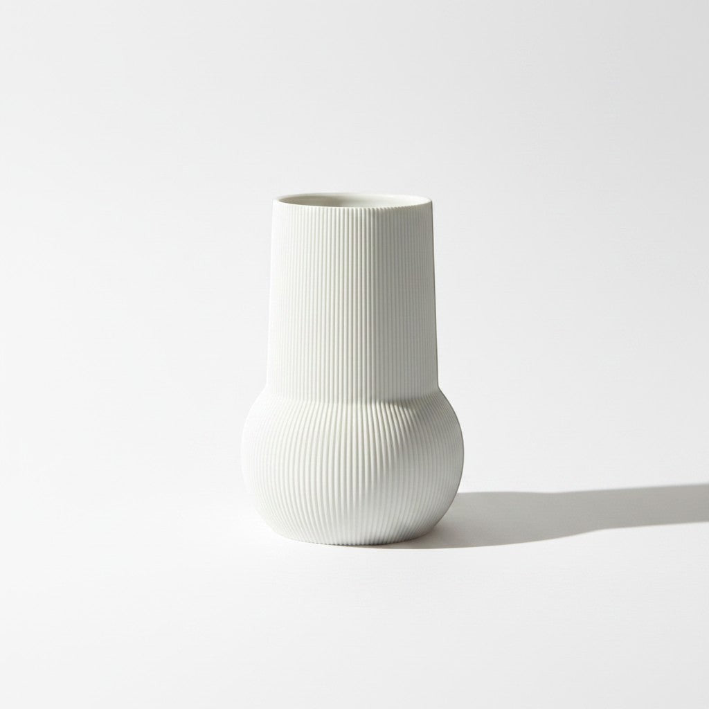 Magicland 3D white ribbed ceramic decorative vase with a rounded base and cylindrical top.