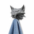 Magicland 3D grey wolf head wall hook holding a blue towel, inspired by The Witcher.