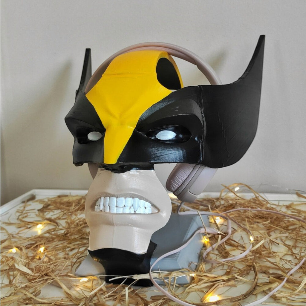 Magicland 3D'den Wolverine temalı kulaklık standı, sarı ve siyah renklerde, detaylı yüz ve diş tasarımlı.