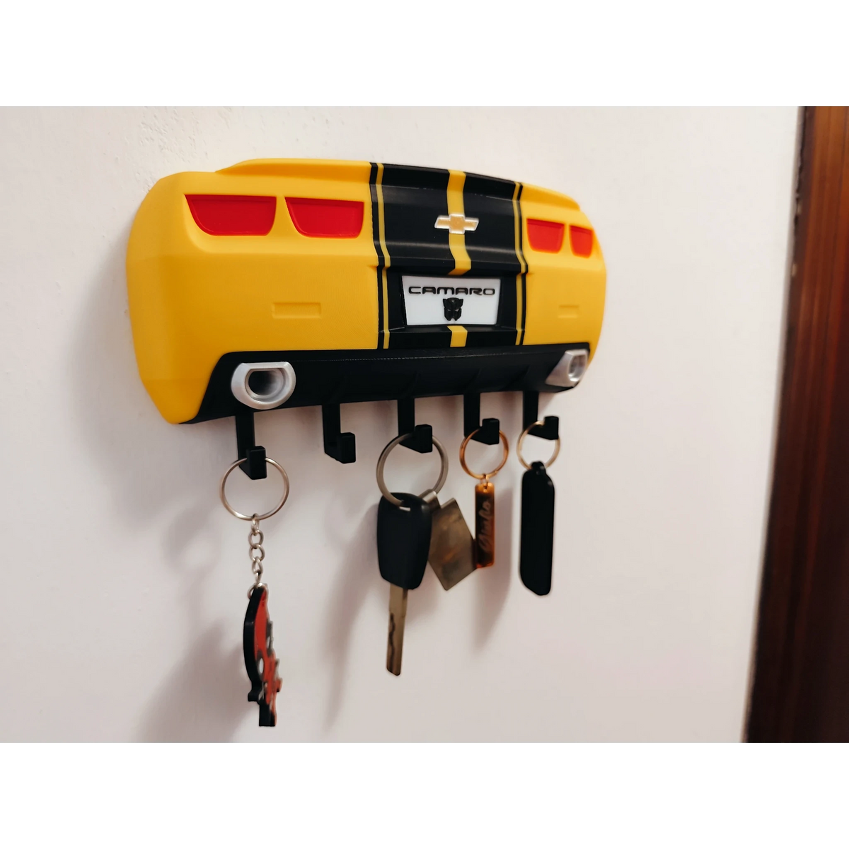 Magicland 3D yellow Chevrolet Camaro rear end key holder with black racing stripes and hooks.