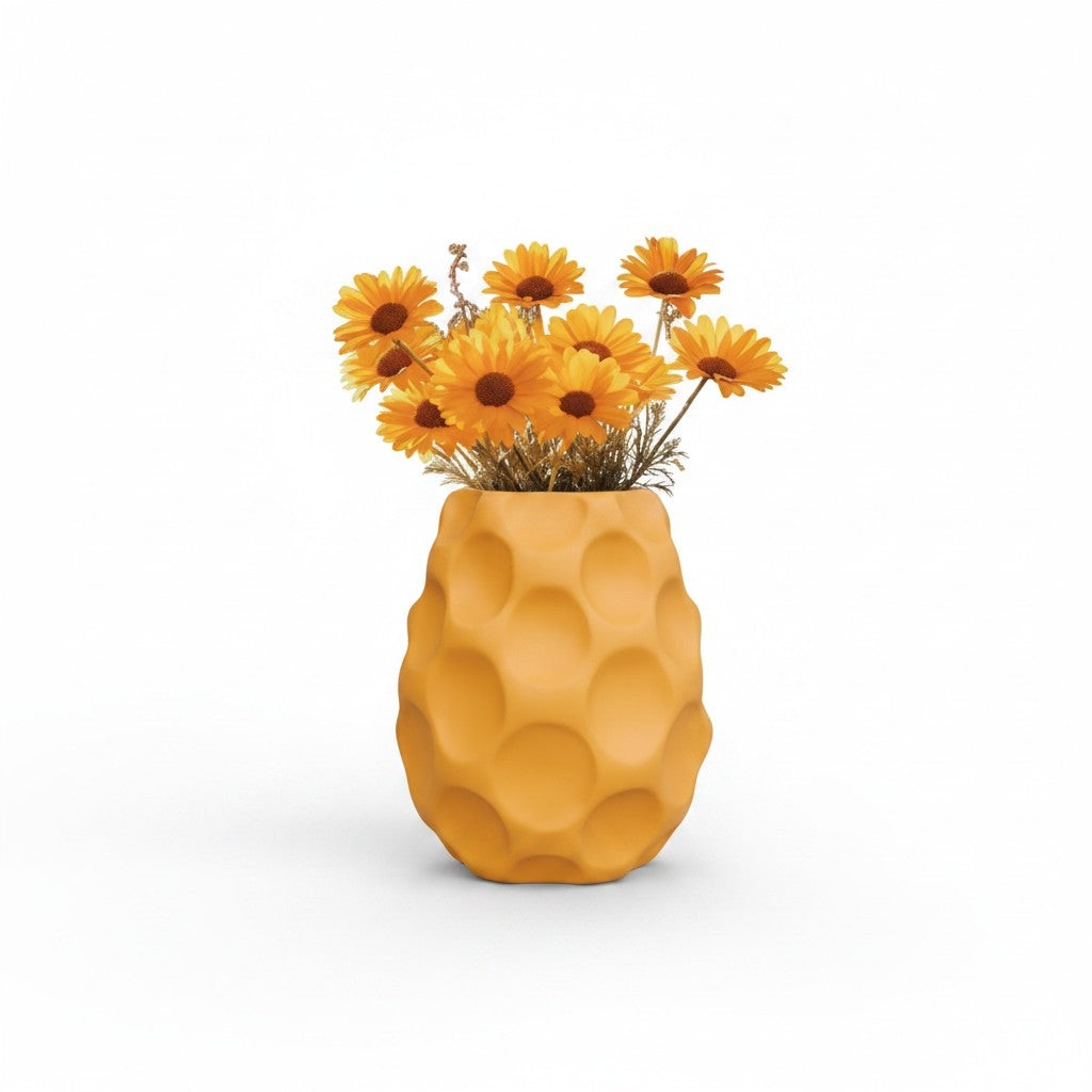 Magicland 3D yellow honeycomb textured decorative vase holding yellow daisies in a field.